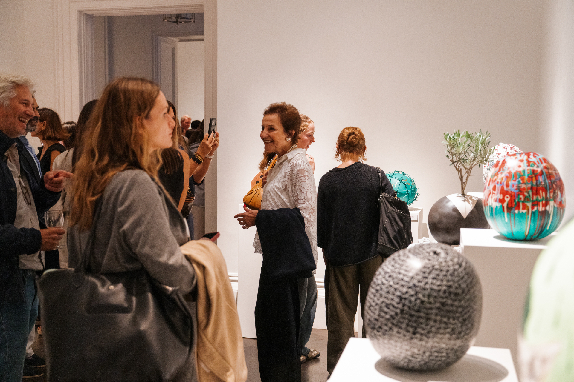 Guests viewing the sculptural works at Bateekha, Gallery 1957, London